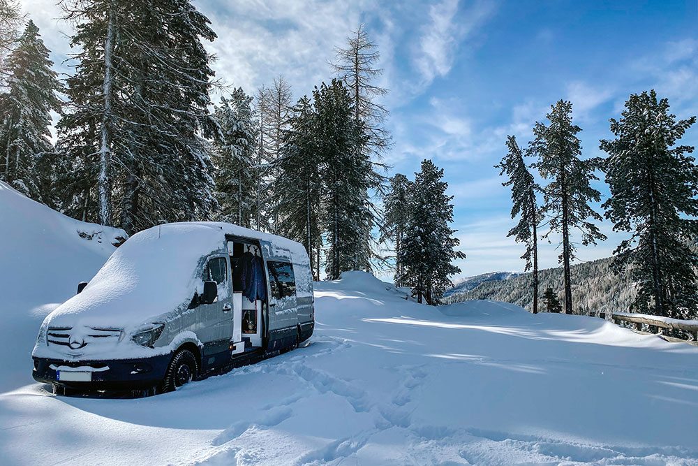 Our campervan parked up in the snow