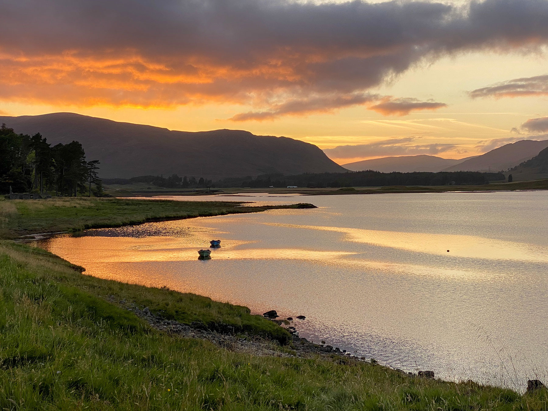 Sunset over a loch in Scotland