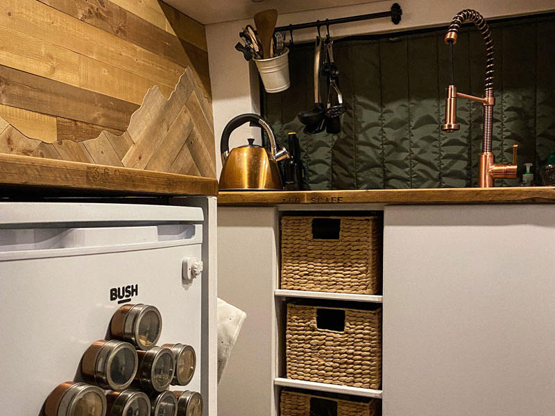 Close up of the cupboards in our kitchen, one of the changes we would make in a second van build