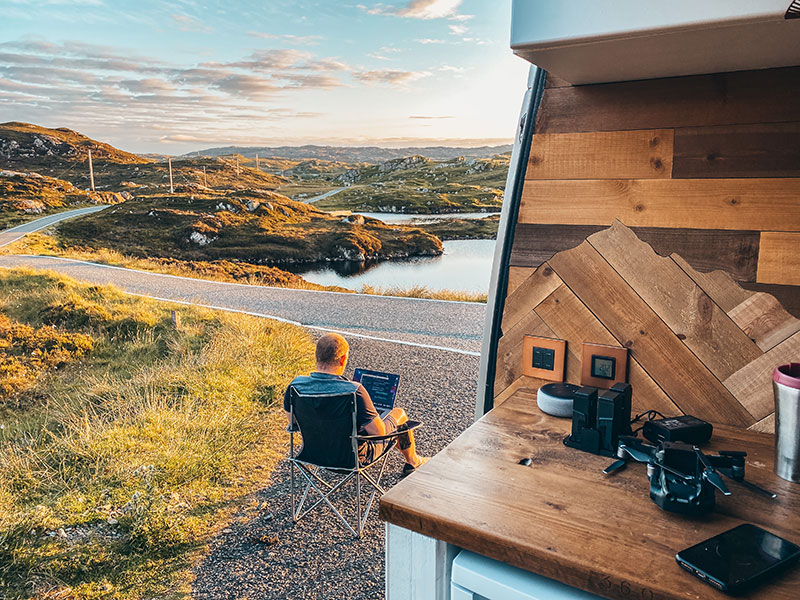 Looking out of campervan side door with view of Isle of Harris